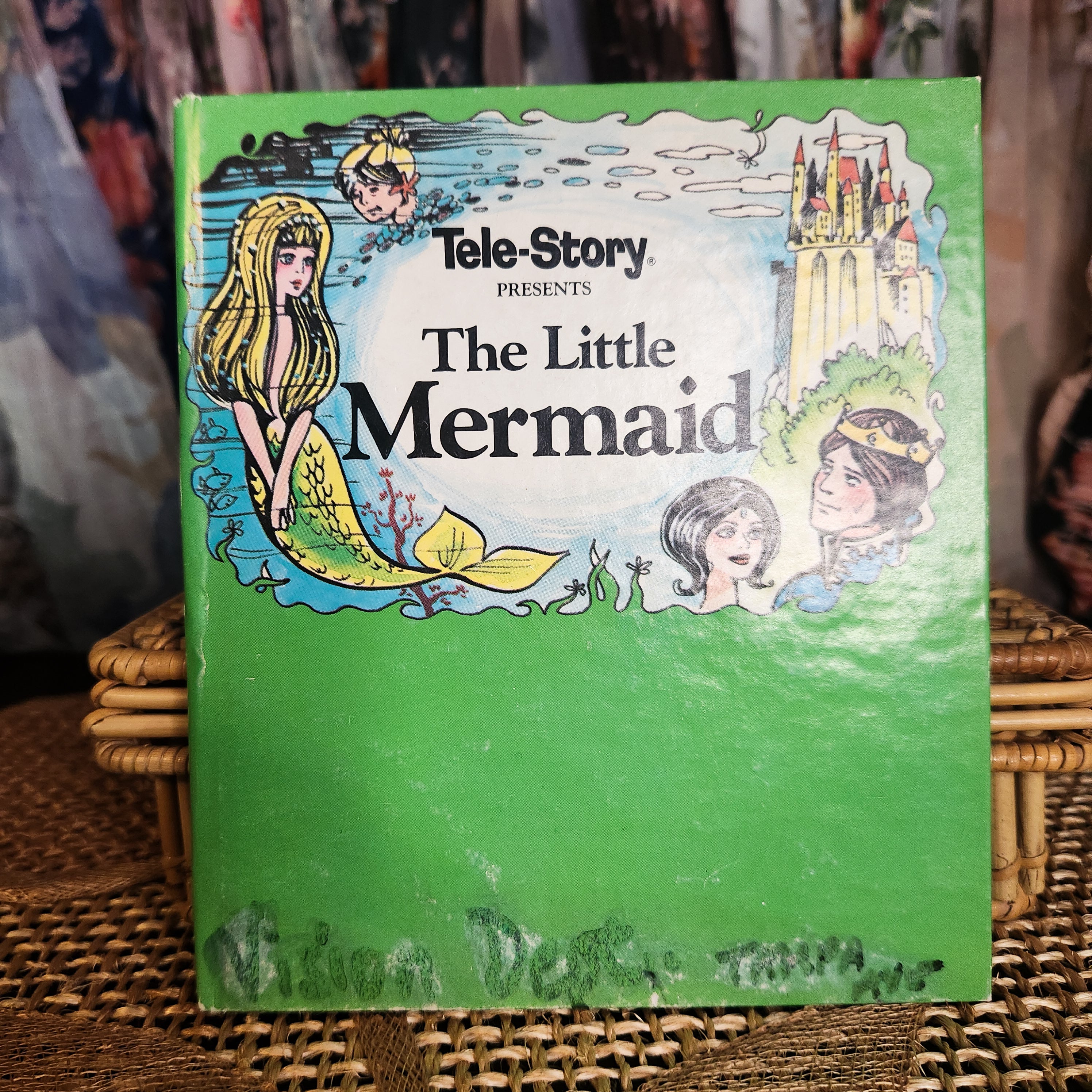 Vintage 'The Little Mermaid' book by Tele-Story on a woven placemat surface